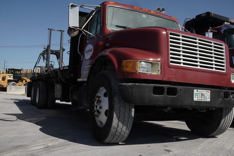 Olimar Stone flatbed delivery truck in the yard